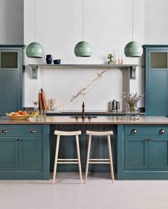 Turquoise kitchen cabinets with creme colour counter tops